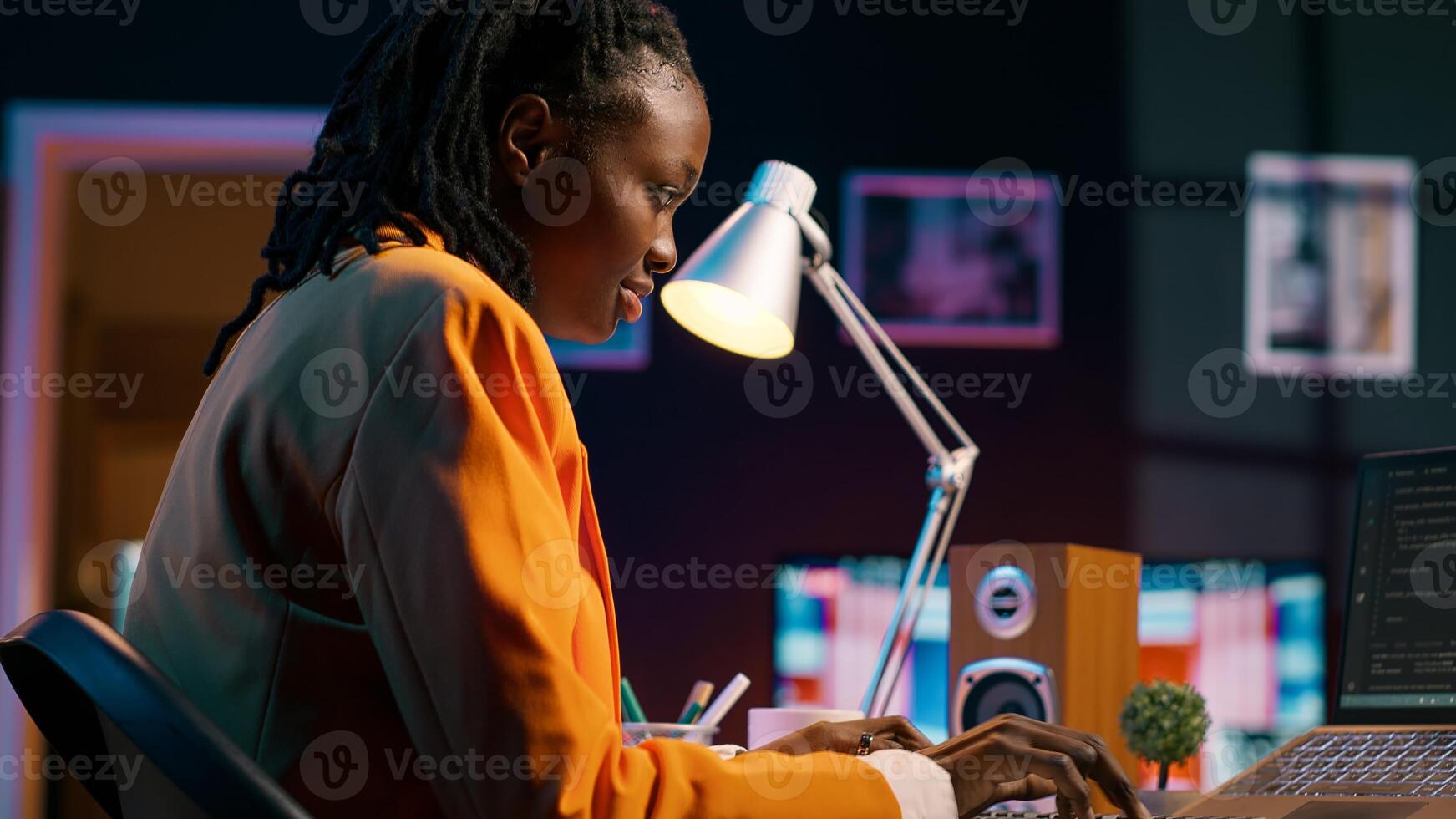 African american system engineer using AI system to write computer program code, html terminal window. Woman works with deep learning algorithms, artificial intelligence neural networks. Camera A. photo