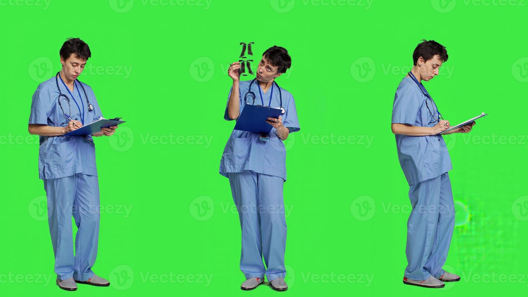 Medical specialist examines x ray scan in hospital laboratory, looking at radiography to determine patient disease diagnosis. Nurse uses radiology expertise against greenscreen backdrop. Camera A. photo