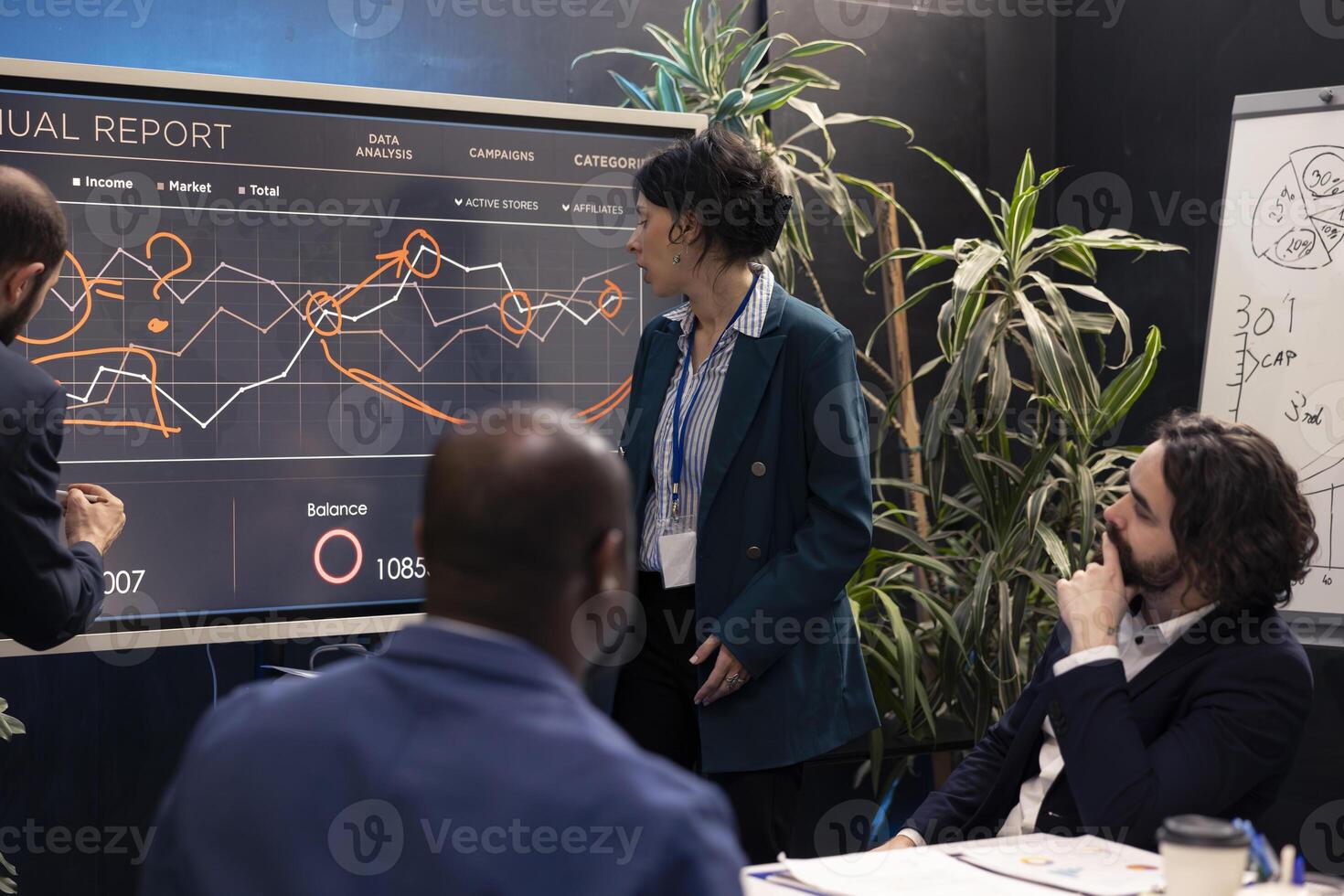 Team members attending conference in a boardroom and presenting the situation, trying to detect challenges or obstacles hindering progress. Supervisor and staff struggling with a project. photo