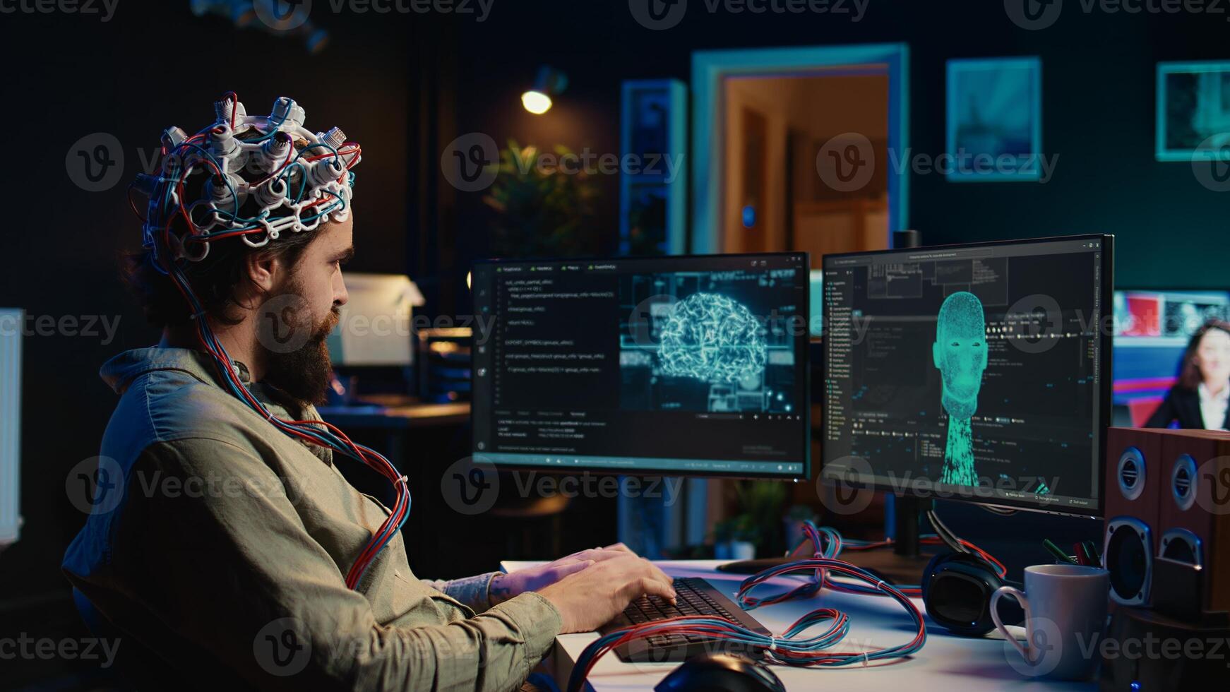 Computer engineer using EEG headset, starting mind upload process using brain machine interface. Man using neuroscientific device to transfer consciousness into cyberspace, typing code, camera B photo