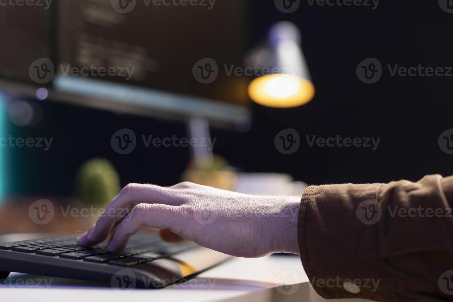 Programmer implementing and maintaining security measures to protect company systems and data. Admin writing, testing and debugging Java code for web and mobile applications, close up photo