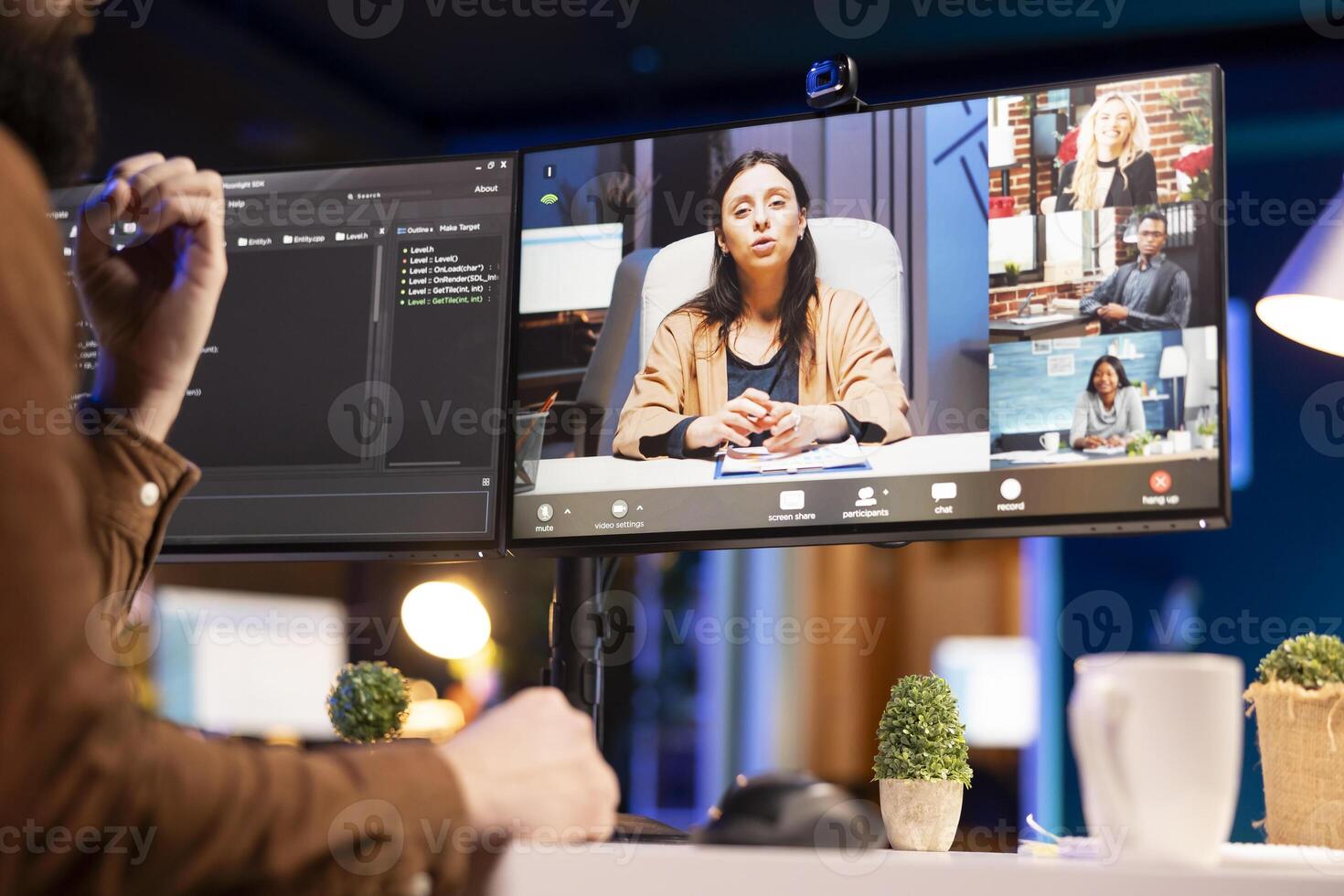 Software engineer teacher doing online tutoring, talking with students in online videocall about ways to do debugging. IT master teaching apprentices in webinar how to write code photo