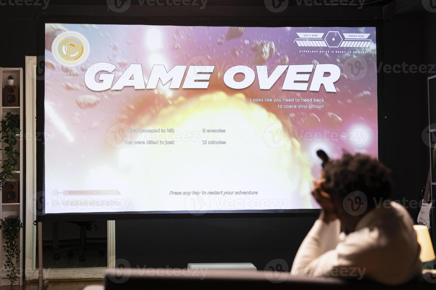 Upset man losing science fiction singleplayer game on gaming console, feeling sad. Player failing to win videogame, annoyed after being defeated by enemies and getting spaceship destroyed photo