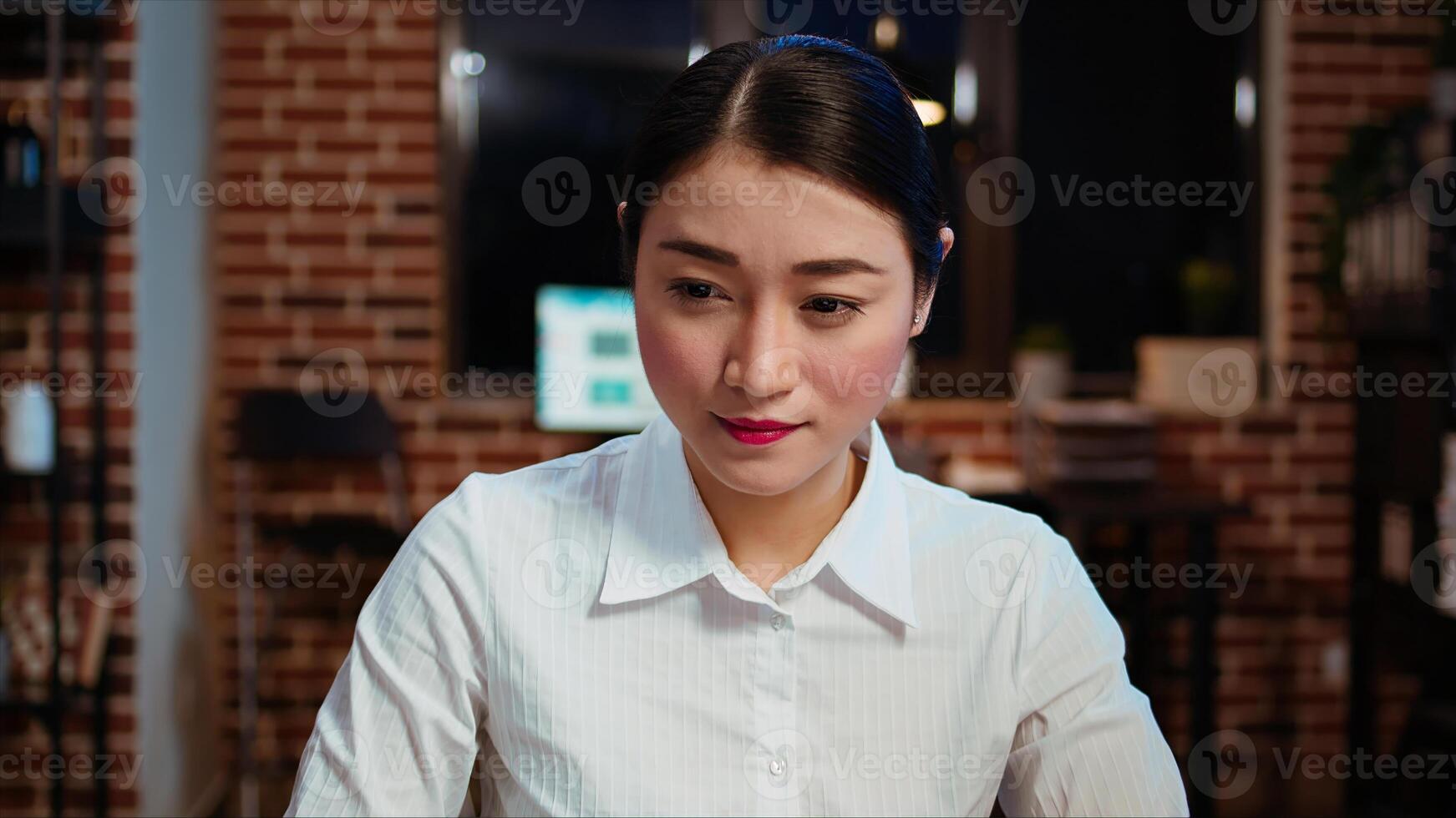 Zoom in on smiling businesswoman inputting financial data on laptop and analyzing sales report to plan business development. Close up of worker in office using device to do project research, camera A photo