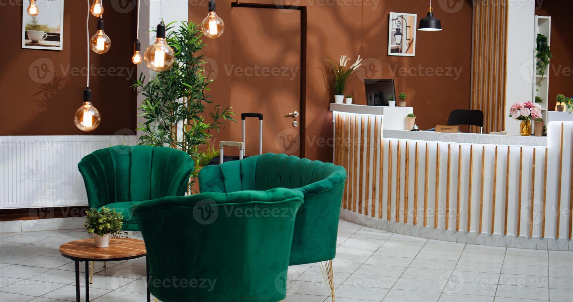 Empty hotel reception lobby with classy expensive decor used to attract customers and important guests. Front desk and lounge area decorated with luxurious furniture, tourism concept. photo