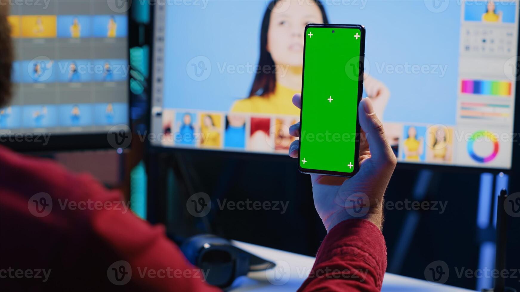 Photographer watching tutorial on mockup mobile phone to learn how to professionally enhance images quality. Photo editor following guide on green screen smartphone about using retouching software