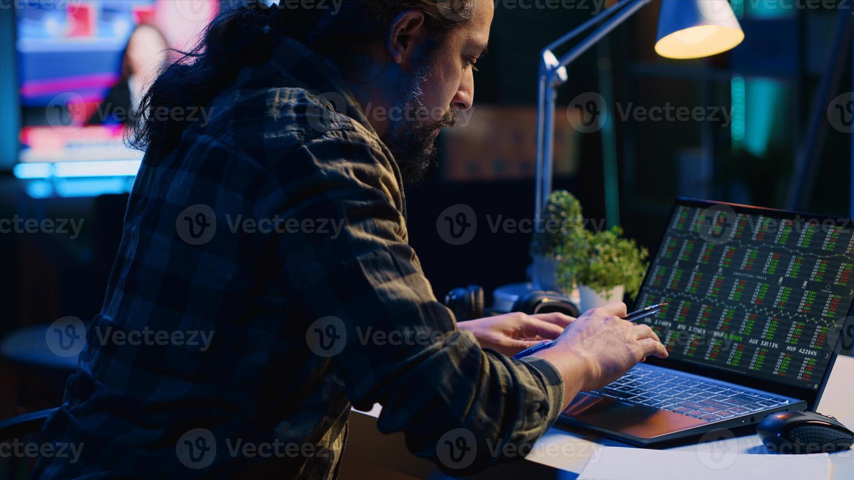 Broker investor employee checking stock exchange valuation financial profit numbers, calculating using pen and paper. Stockholder looking at market shares growth, writing on notepad, camera A photo