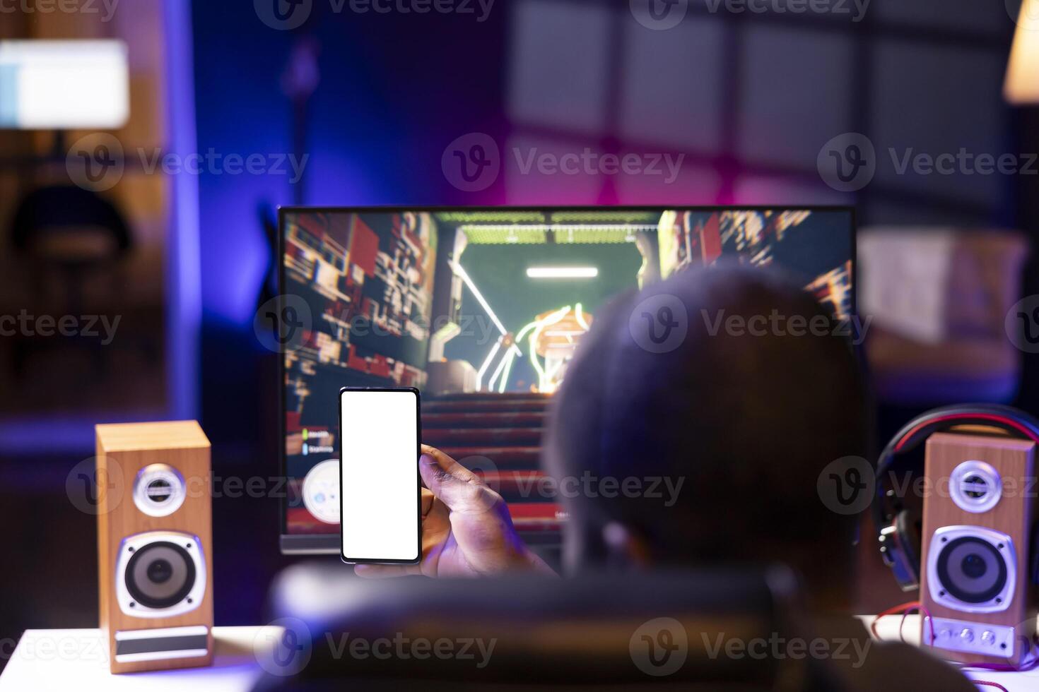 Man watching favorite content creator on isolated screen smartphone showing tips for game he is currently playing, close up. Player looking online for inspiration on mockup phone, stuck on mission photo