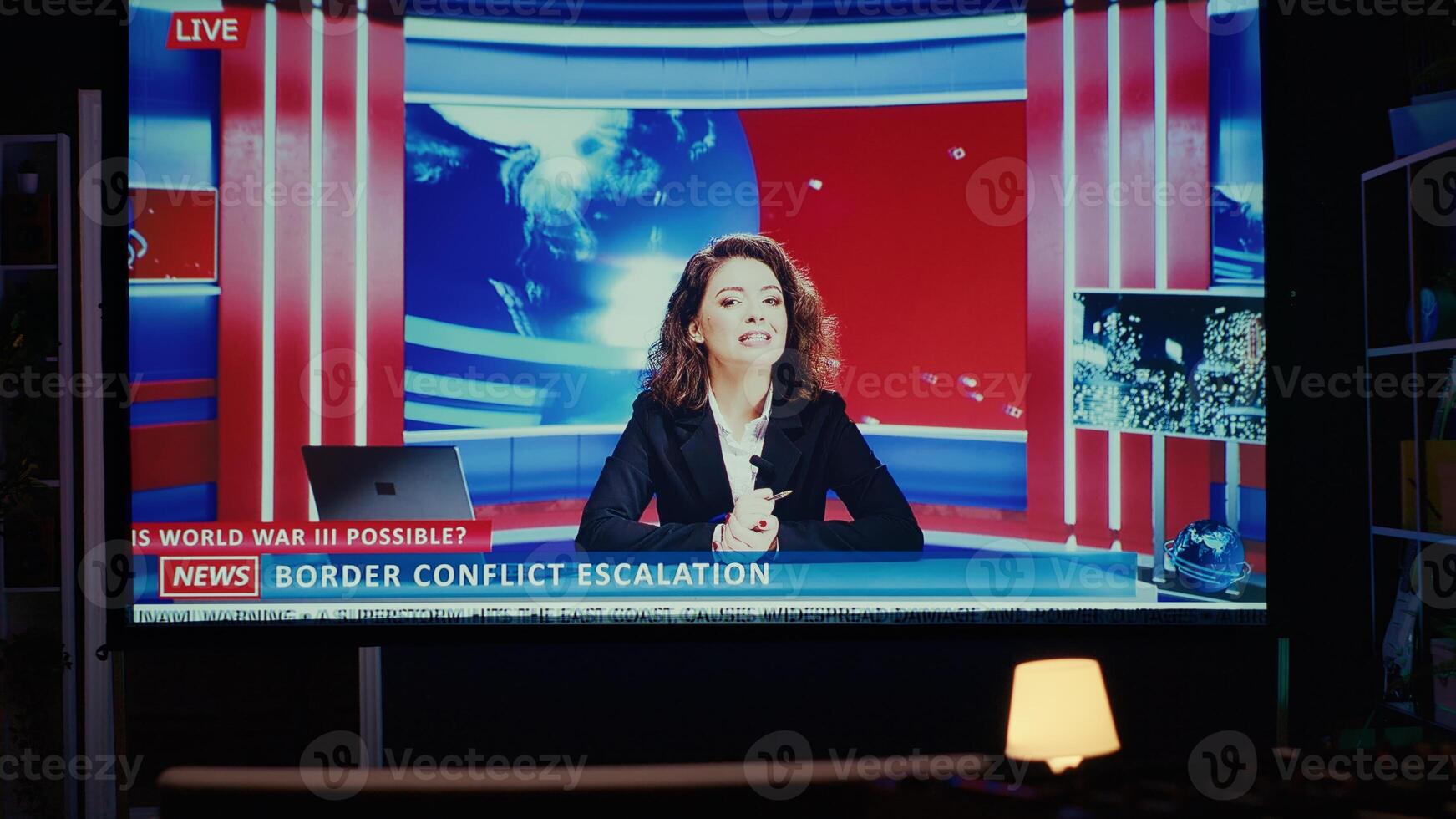 News reporter covering different subjects on VOD subscription based journalism channel. Ultrawide smart TV in empty dimly lit apartment living room showing journalist talk about reportages photo