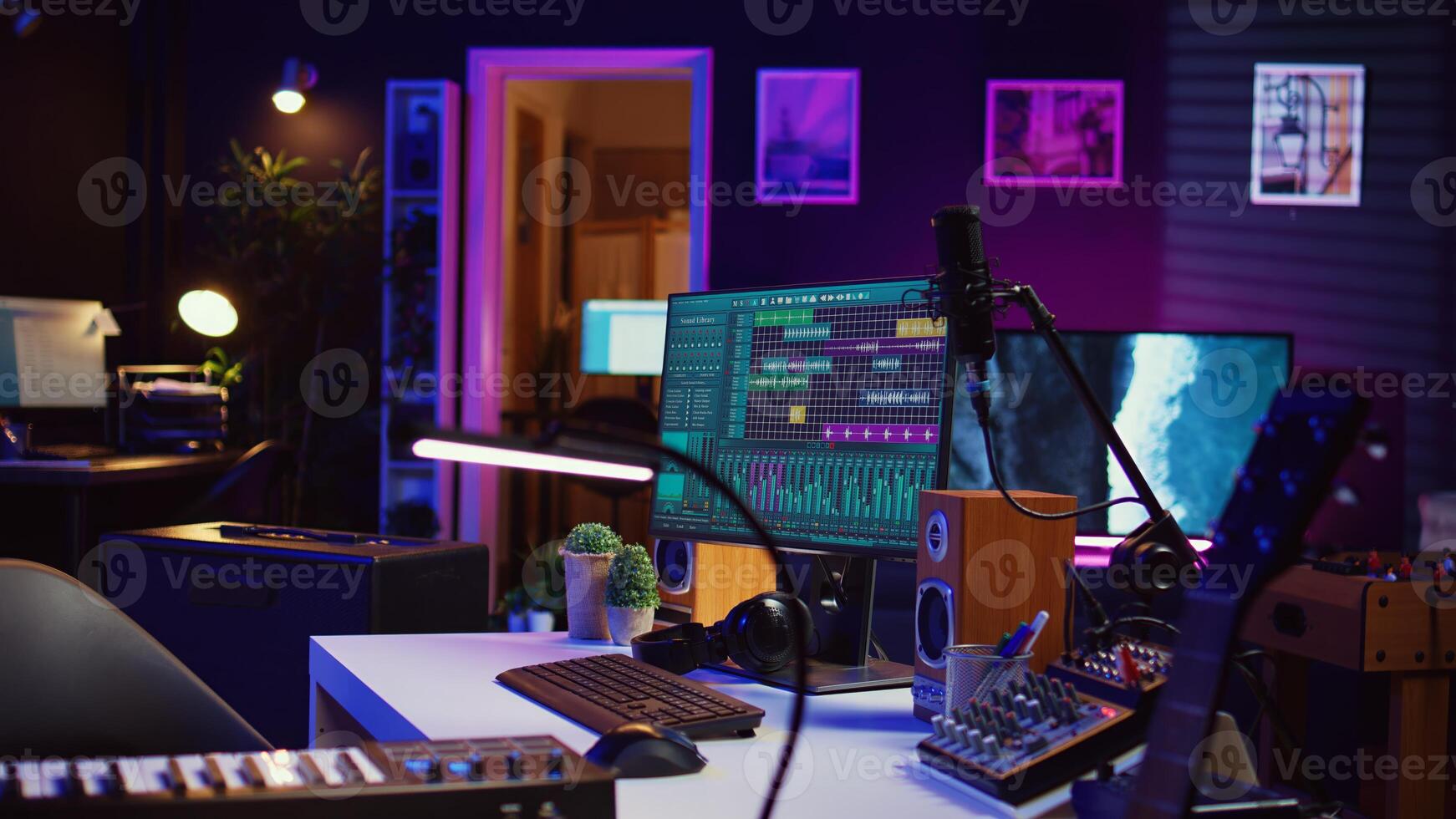 Electronic instruments used for mixing and recording tunes in empty home studio, soundboard controls and mastering console used to create songs. Creative space with amplifier and equalizer. Camera B. photo