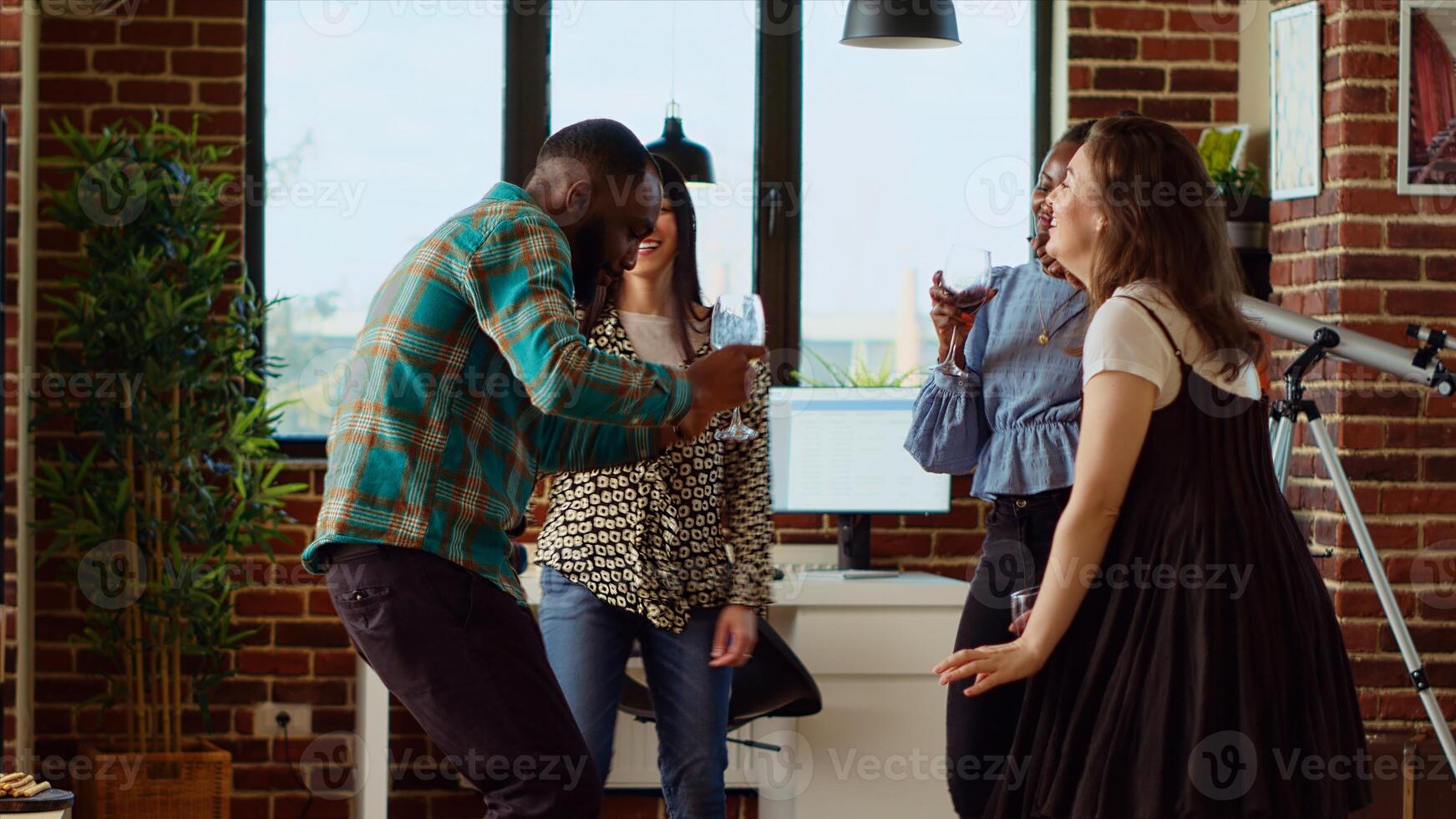 Diverse group of school colleagues organizing apartment party, enthusiastically dancing to electronic songs. Friends enjoying time spent together, busting into animated dance moves in cozy house photo