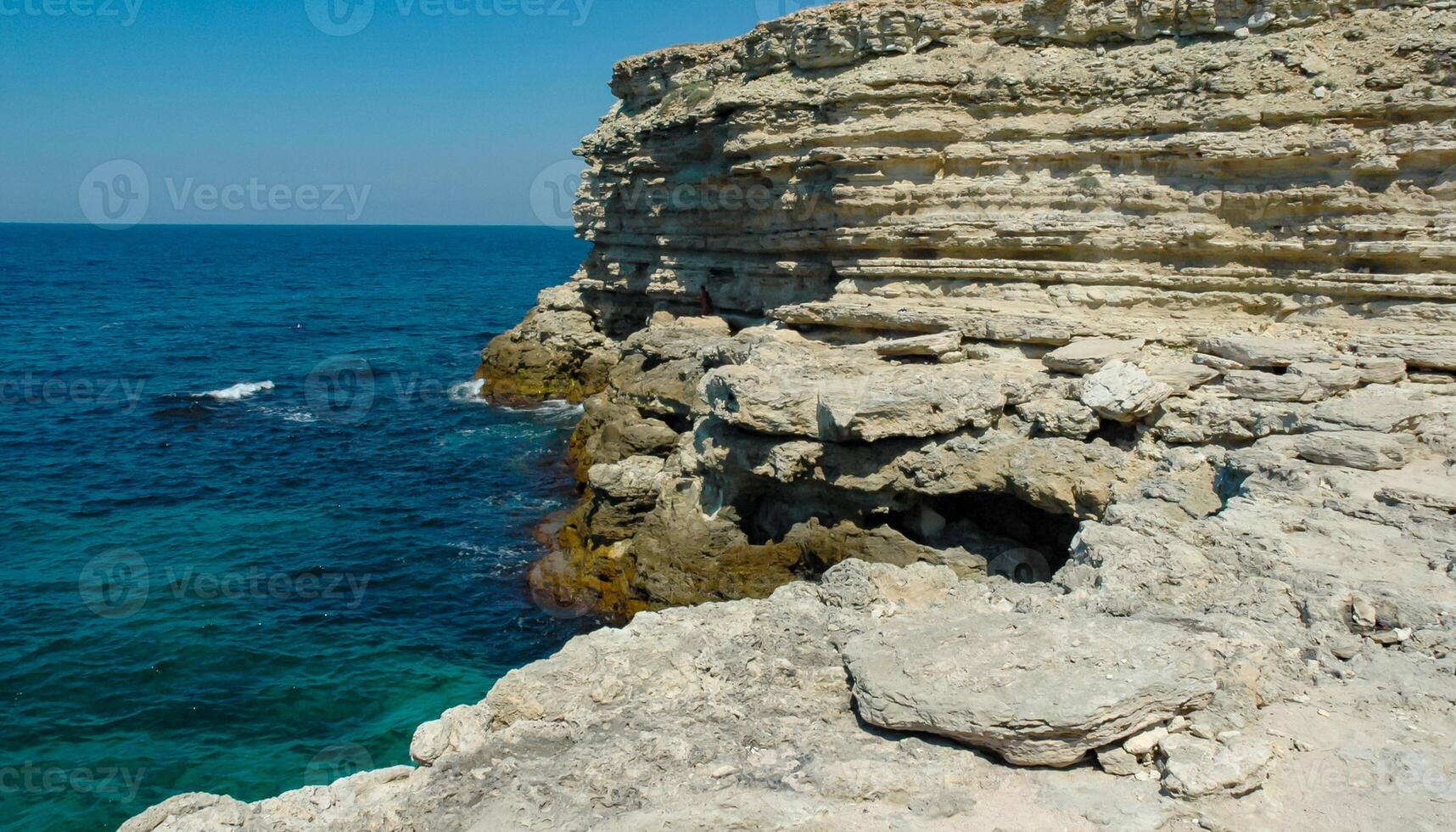 Steep karst limestone shores and rocks in the Dzhangul tract, western Crimea, Tarkhankut photo