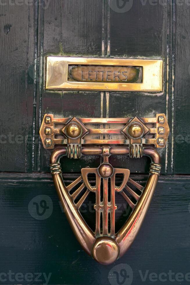 view of a traditional maltese door on old buildings with a hammer handle in Valletta on the island of Malta photo