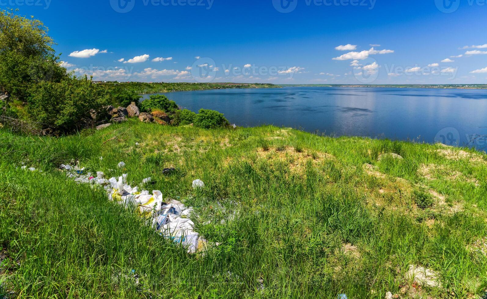 Environmental problem, pollution of the shores of a reservoir with construction and plastic waste, Khadzhibey estuary photo