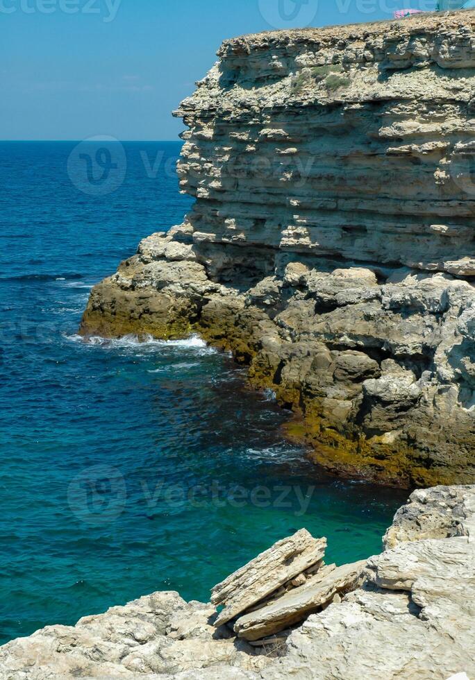 Steep karst limestone shores and rocks in the Dzhangul tract, western Crimea, Tarkhankut photo