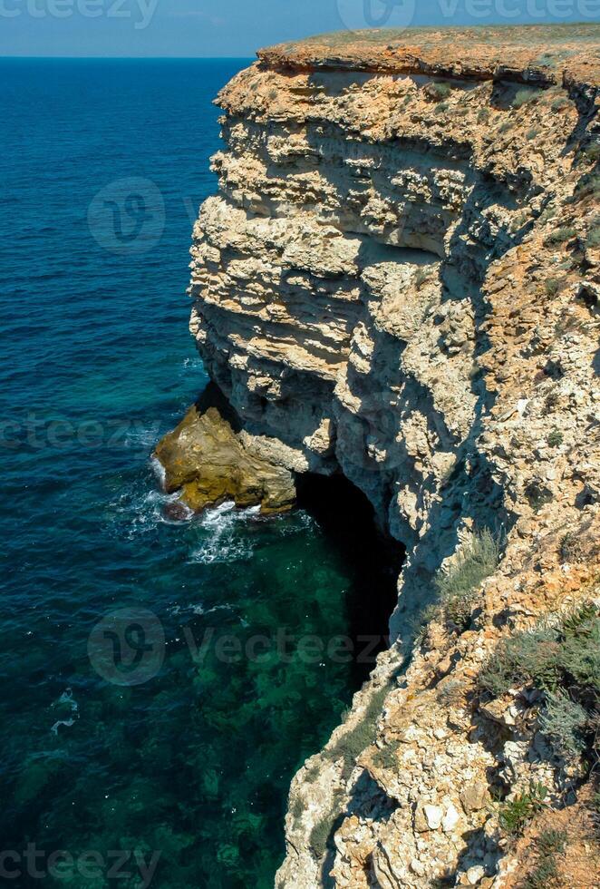 Steep karst limestone shores and rocks in the Dzhangul tract, western Crimea, Tarkhankut photo