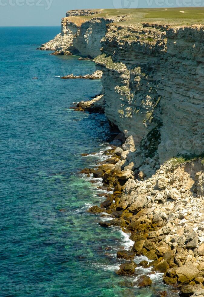 Steep karst limestone shores and rocks in the Dzhangul tract, western Crimea, Tarkhankut photo