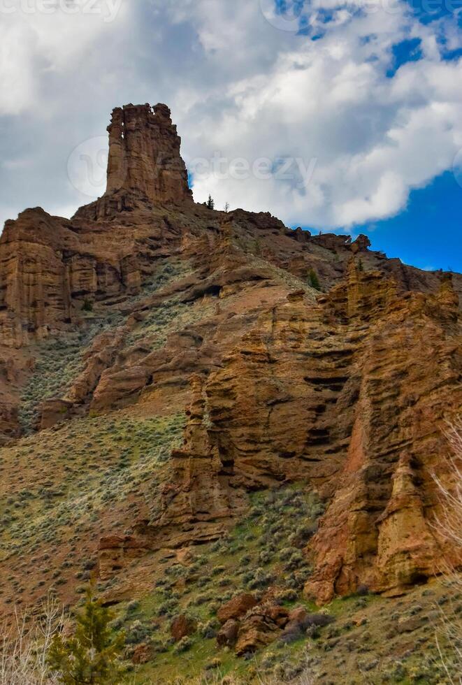 Nature Montana. Mountain landscape, red rocks against the backdrop of a cloudy sky in Montana, USA photo