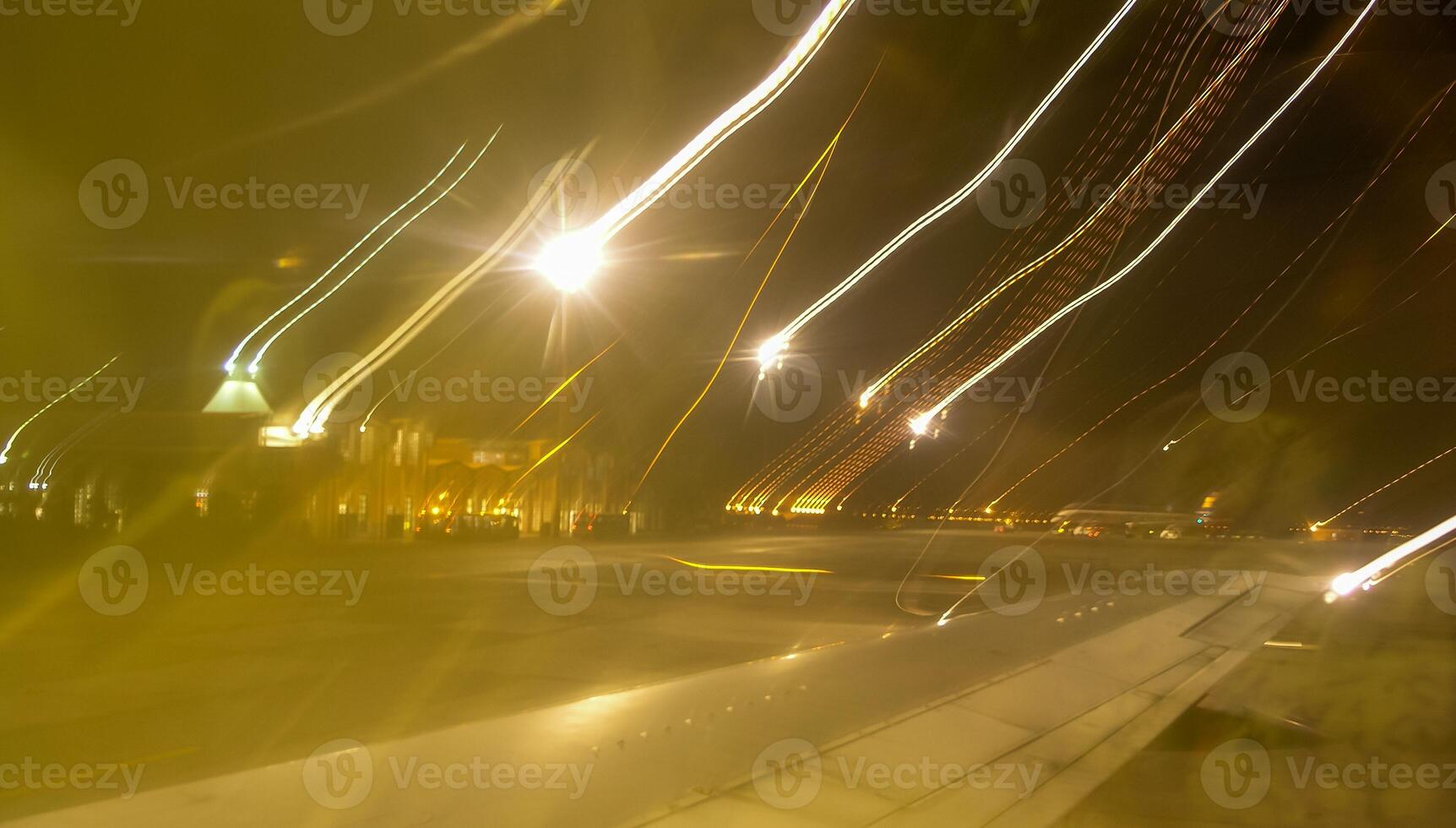 Blurred frame, abstract movement of light from lighting lanterns at the airfield, Egypt photo