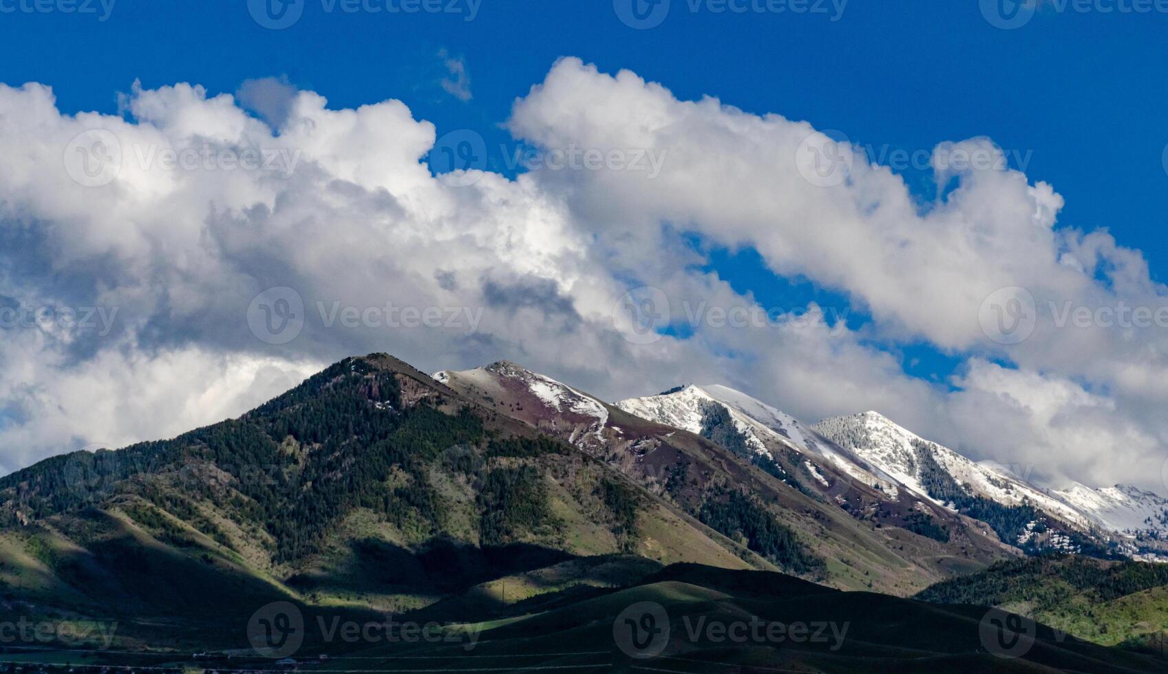 Rain clouds during the day over mountains in the state, US photo