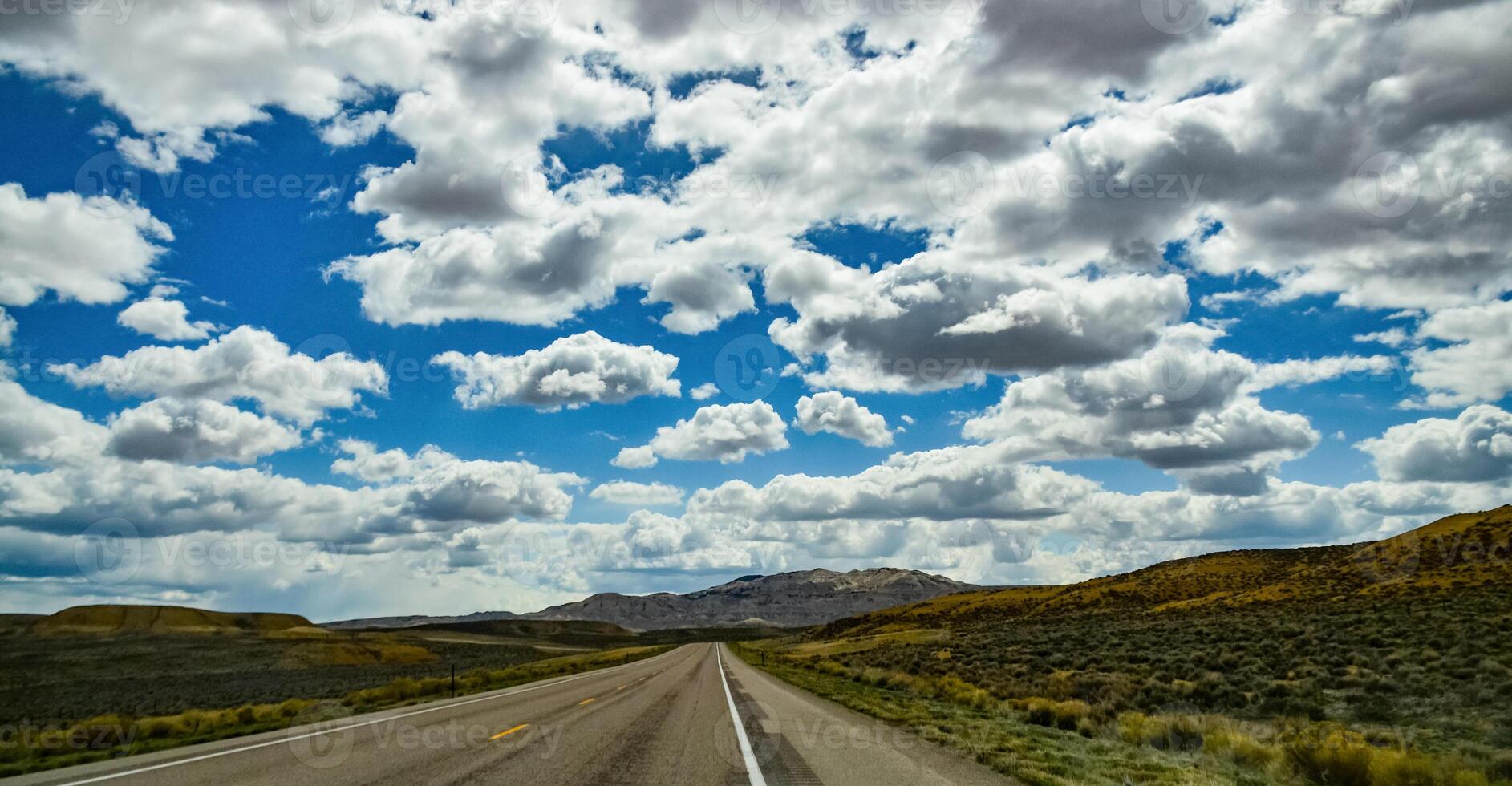 Rain clouds during the day over the plains in Utah, US photo