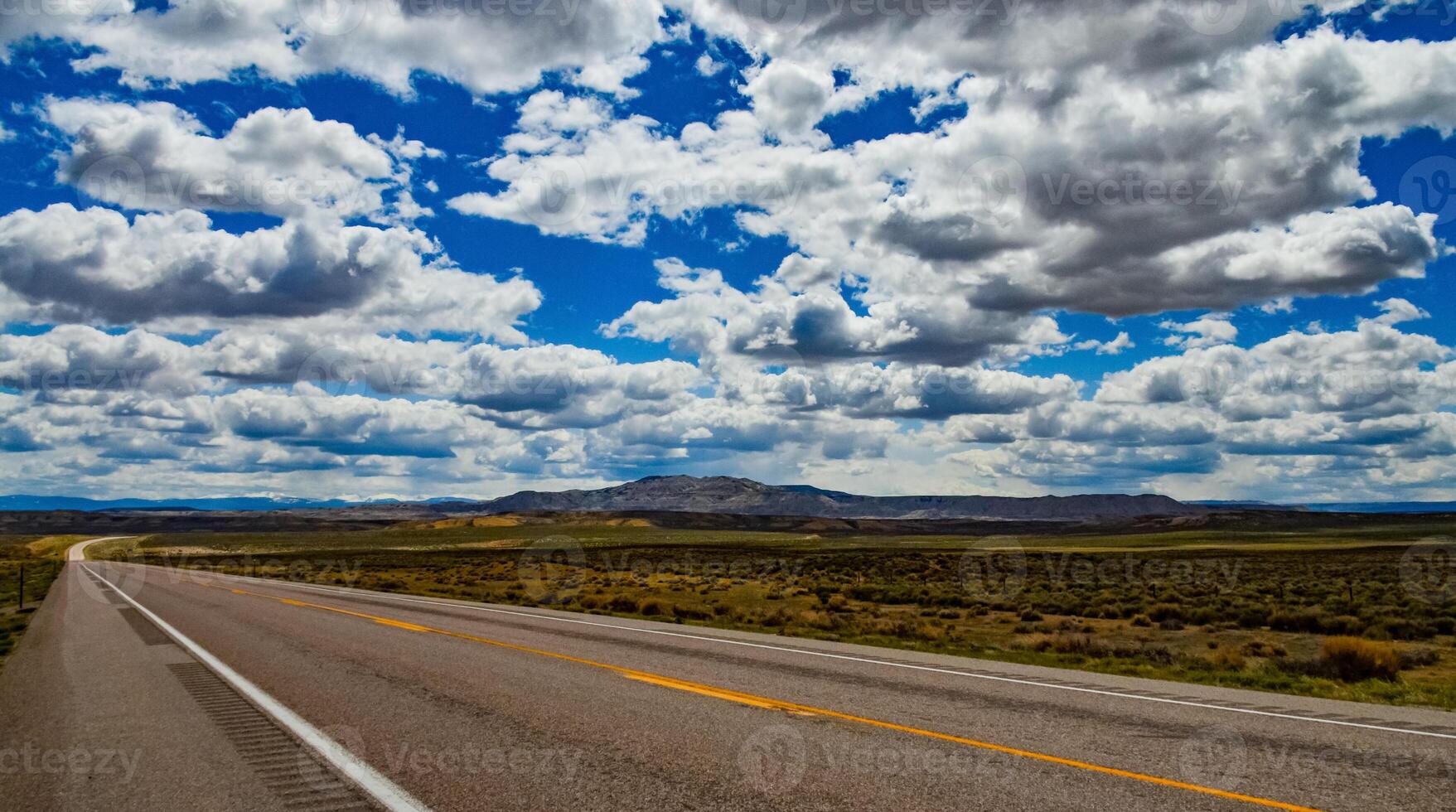 Rain clouds during the day over the plains in Utah, US photo