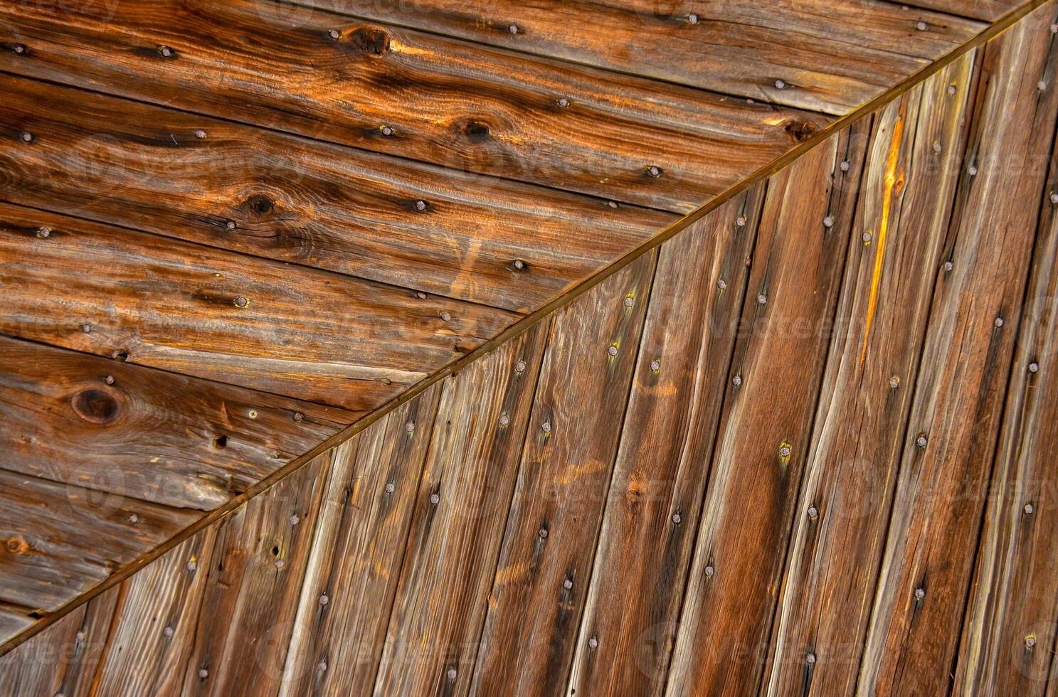 Wooden background, vintage rotten planks that survived on an old 18th century barn, Ohio USA photo