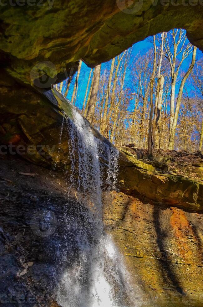 A small waterfall in the autumn in the forest in the parkon Brandywine Creek in Cuyahoga Valley National Park, Ohio. photo
