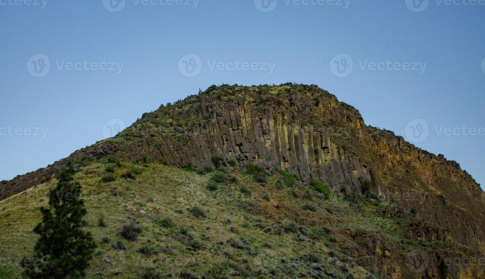 Mountain formations from vertical columnar lava formations, USA photo