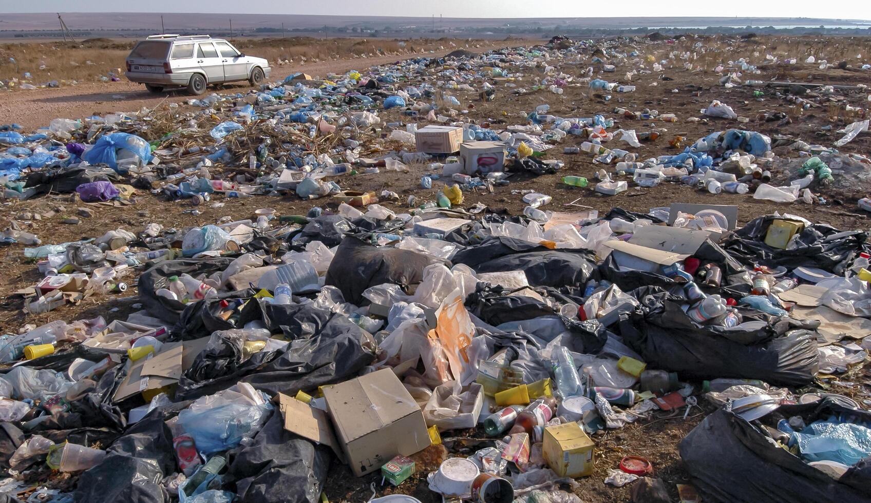UKRAINE, CRIMEA - AUGUST 10, 2007 Pollution of the steppe nature with plastic household waste photo