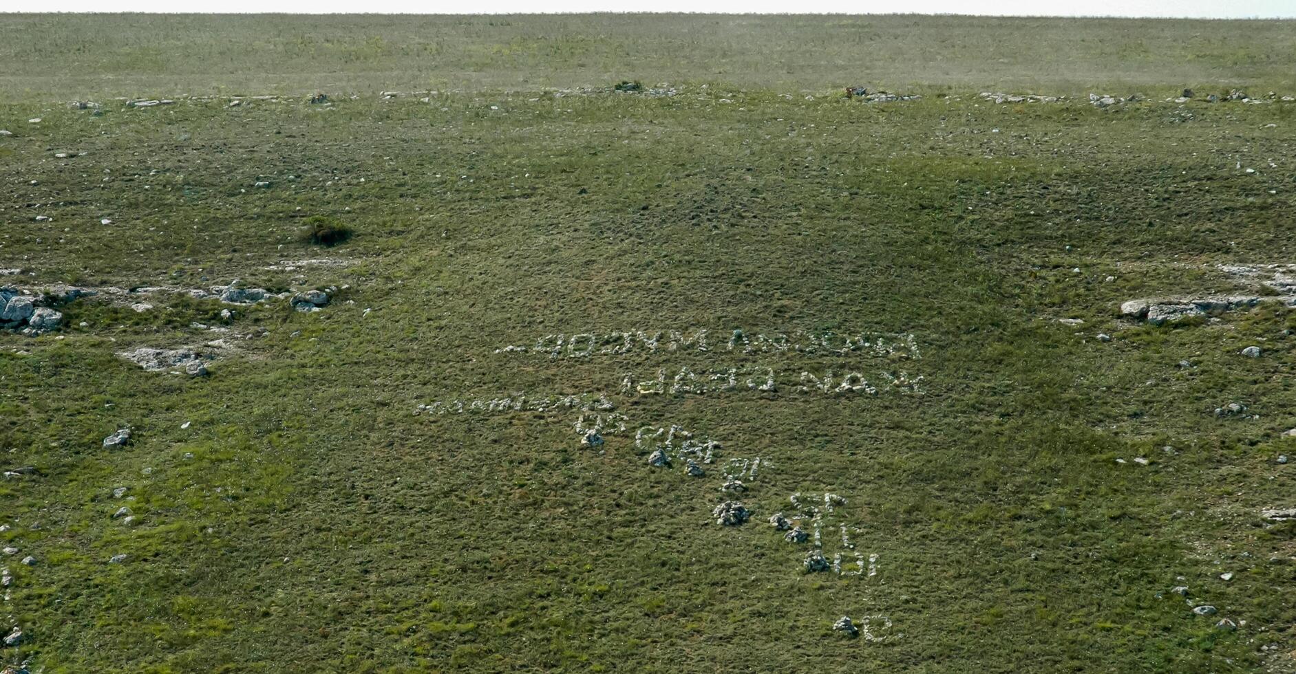 Stone inscriptions on the gentle slopes of the steppe coast of Dzhangul in the western Crimea, Tarkhankut photo