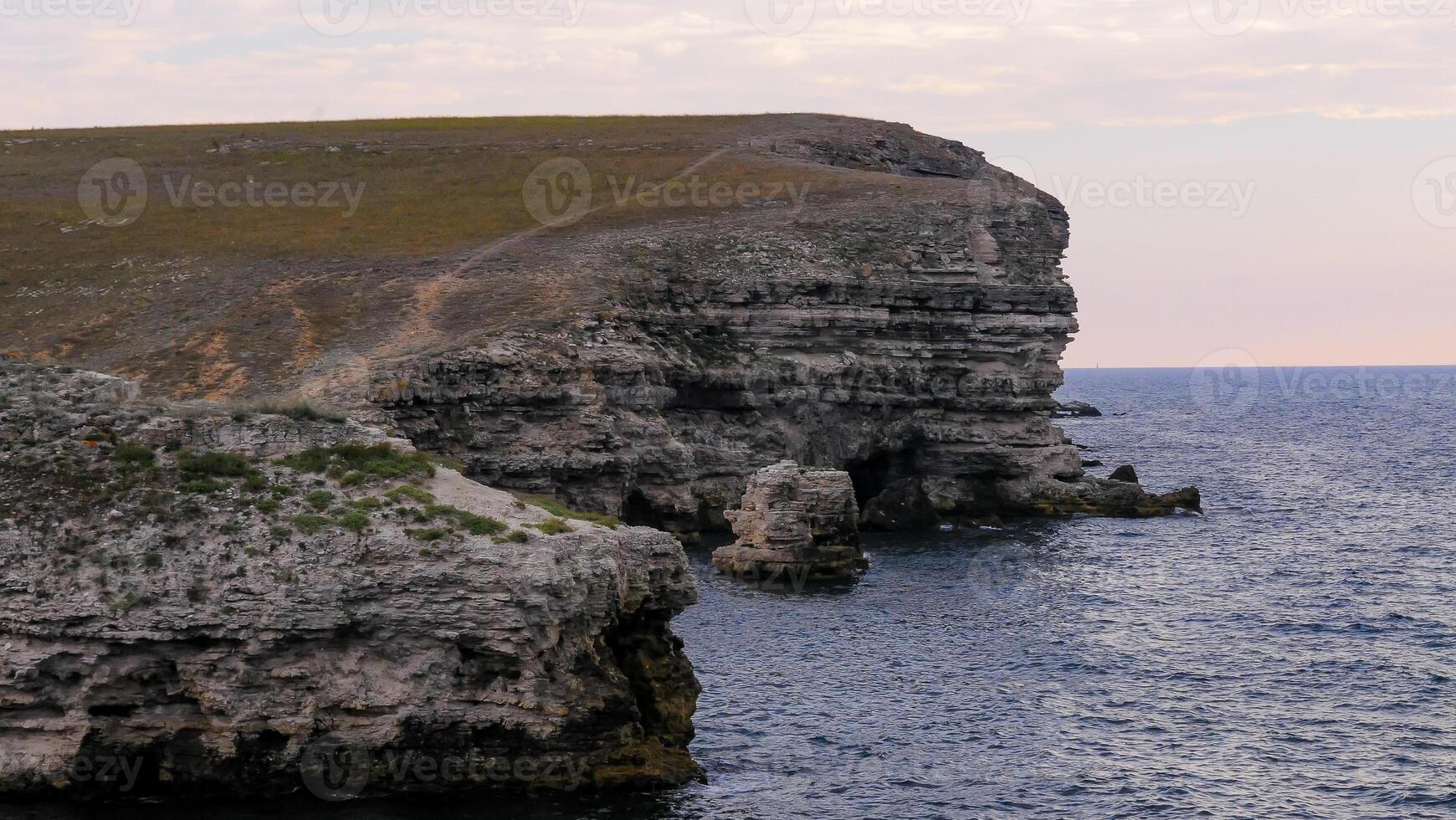 Steep rocky coast of Pontic limestones in eastern Crimea photo