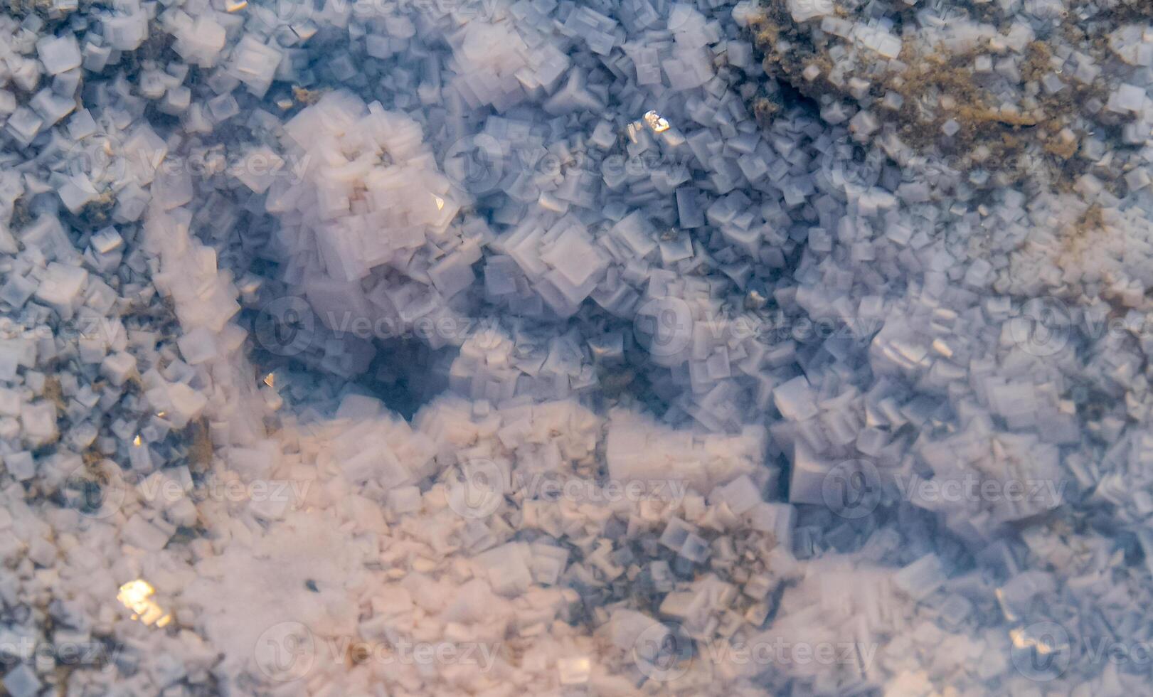 Crystals of self-precipitating table salt on the shore of a drying salt lake in eastern Crimea photo