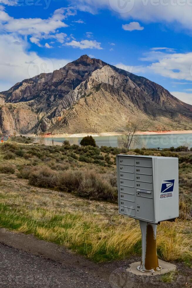 USA, MONTANA - APRIL 28, 2018 letterbox on the side of a road on the shore of a mountain lake in a valley among the mountains in Montana photo