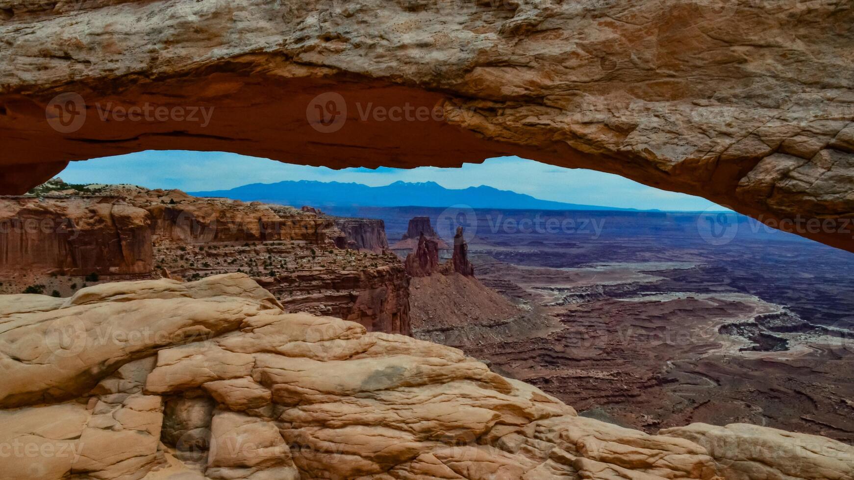 View from Mesa Arch in Canyonlands National Park near Moab, Utah, US photo