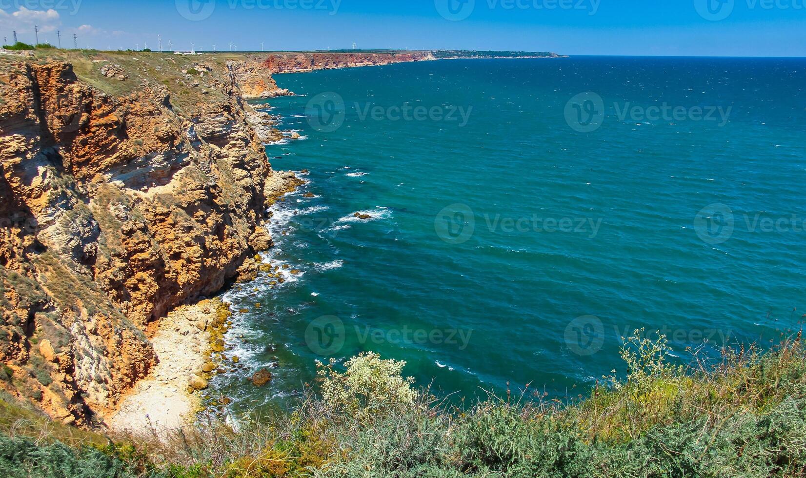 Steep coast with karst caves and grottoes near the village of Tyulenovo photo