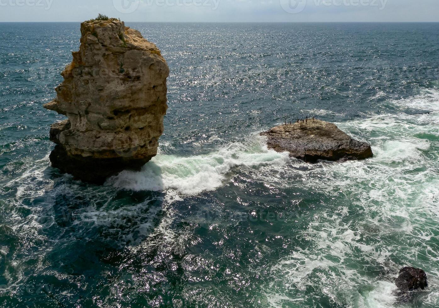 High impregnable rock in the water near the village of Tyulenovo in Bulgaria, Black Sea photo