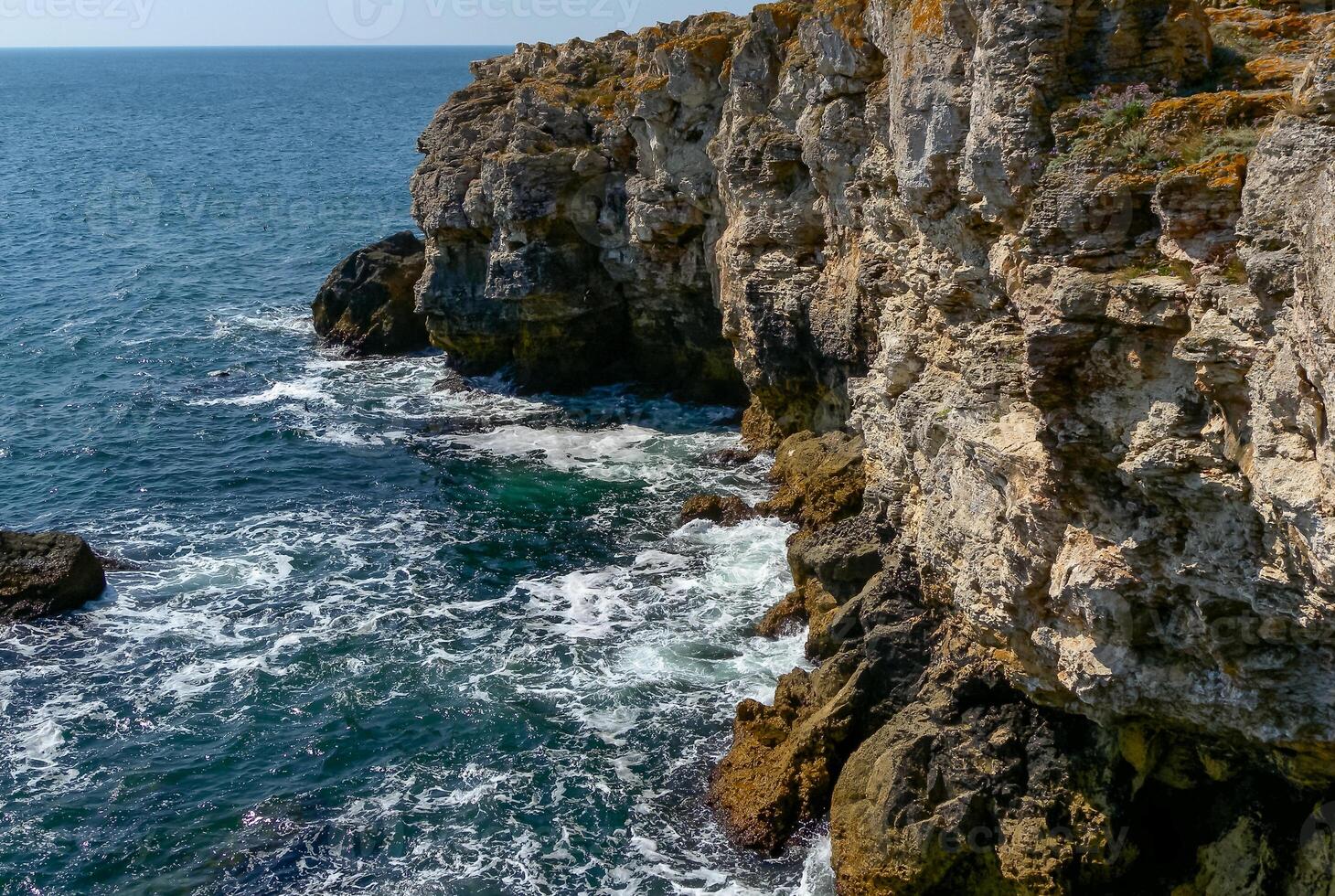 Picturesque steep banks and cliffs of the Black Sea coast near the village of Tyulenovo photo