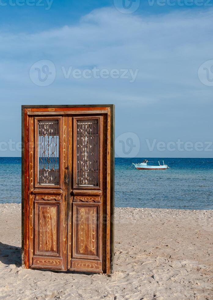 Art object in the form of a door on the shore of the Red Sea, a photo zone for tourists