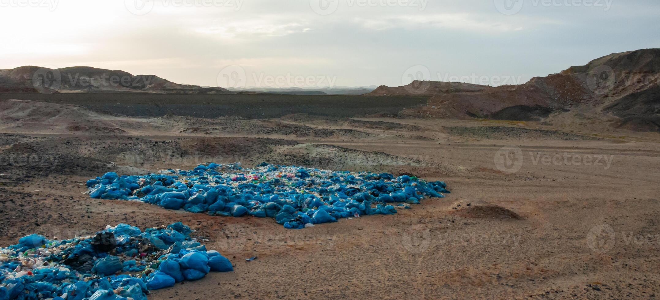 Plastic bottles and various garbage from hotels in the wild, Garbage dump in the desert in Egypt photo