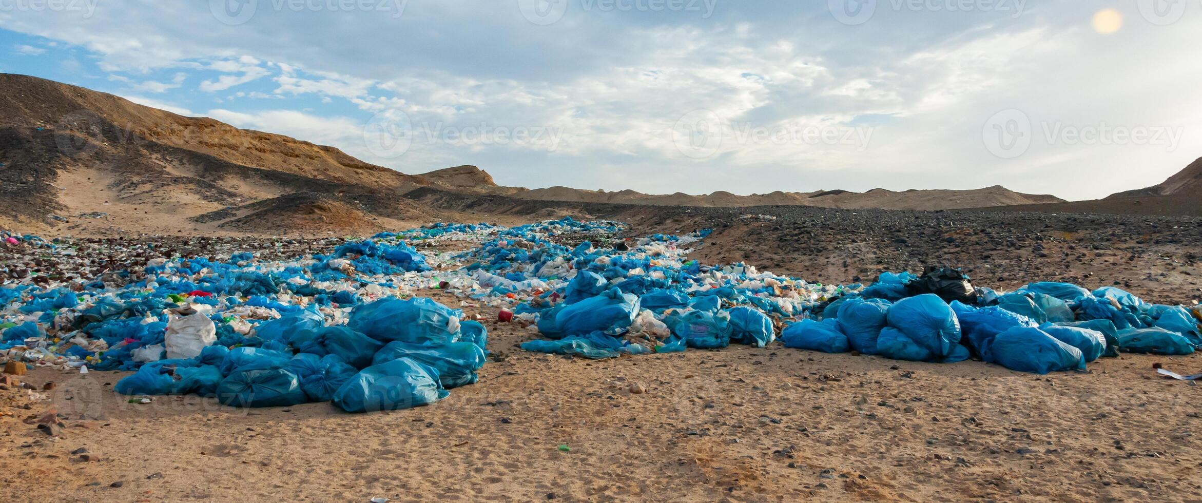 Plastic bottles and various garbage from hotels in the wild, Garbage dump in the desert in Egypt photo