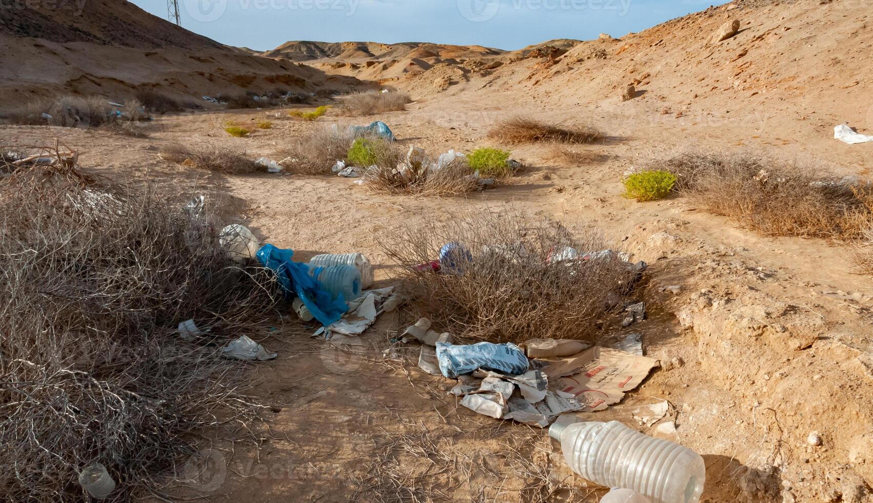 Plastic bottles and various garbage from hotels in the wild, Garbage dump in the desert in Egypt photo