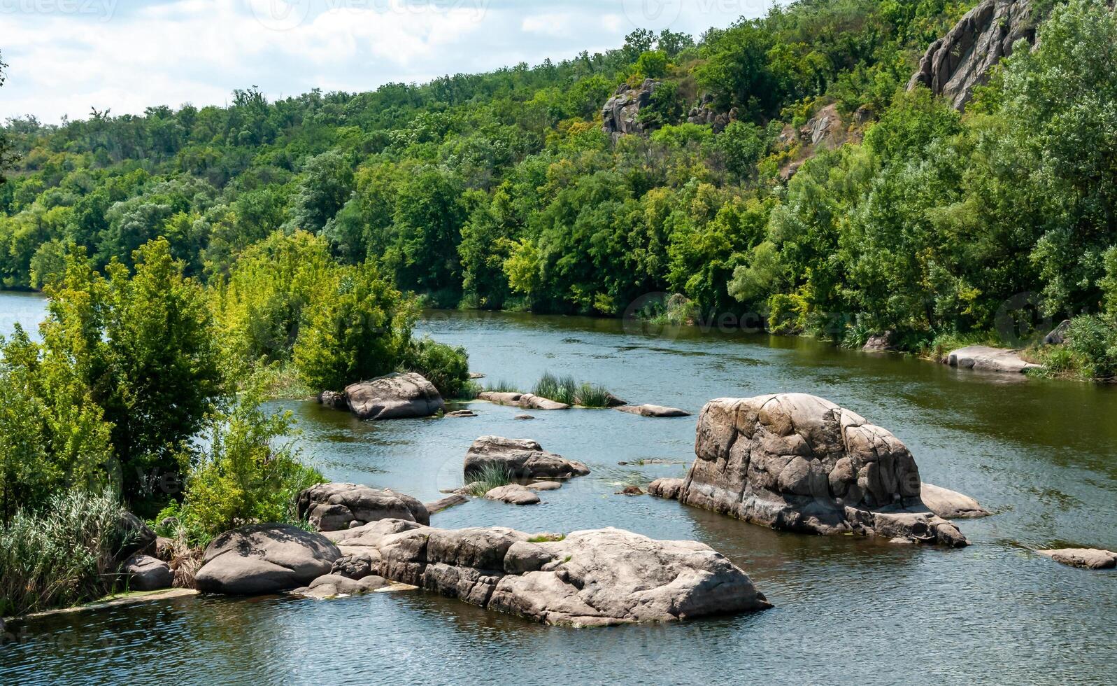 Natural landscape, the bed of the Southern Bug river with granite rifts in the Nikolaev region photo