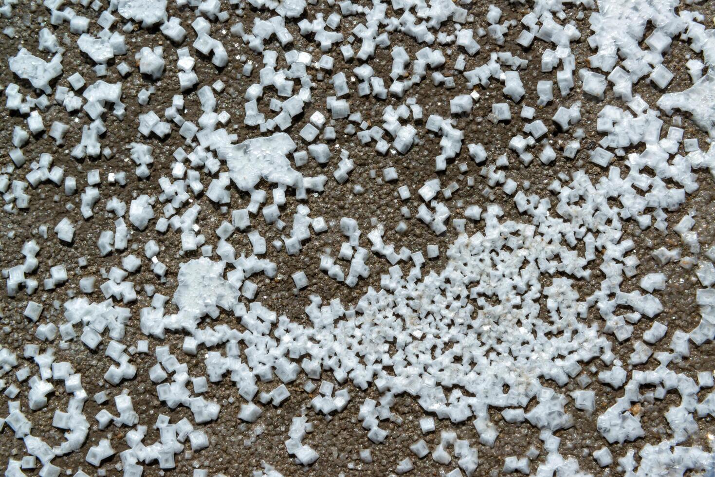 Crystals of self-precipitating common salt -sodium chloride- crystallized at the bottom photo