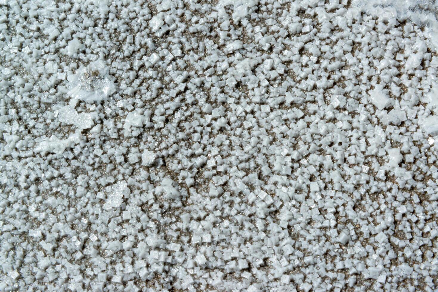 Crystals of self-precipitating common salt -sodium chloride- crystallized at the bottom photo