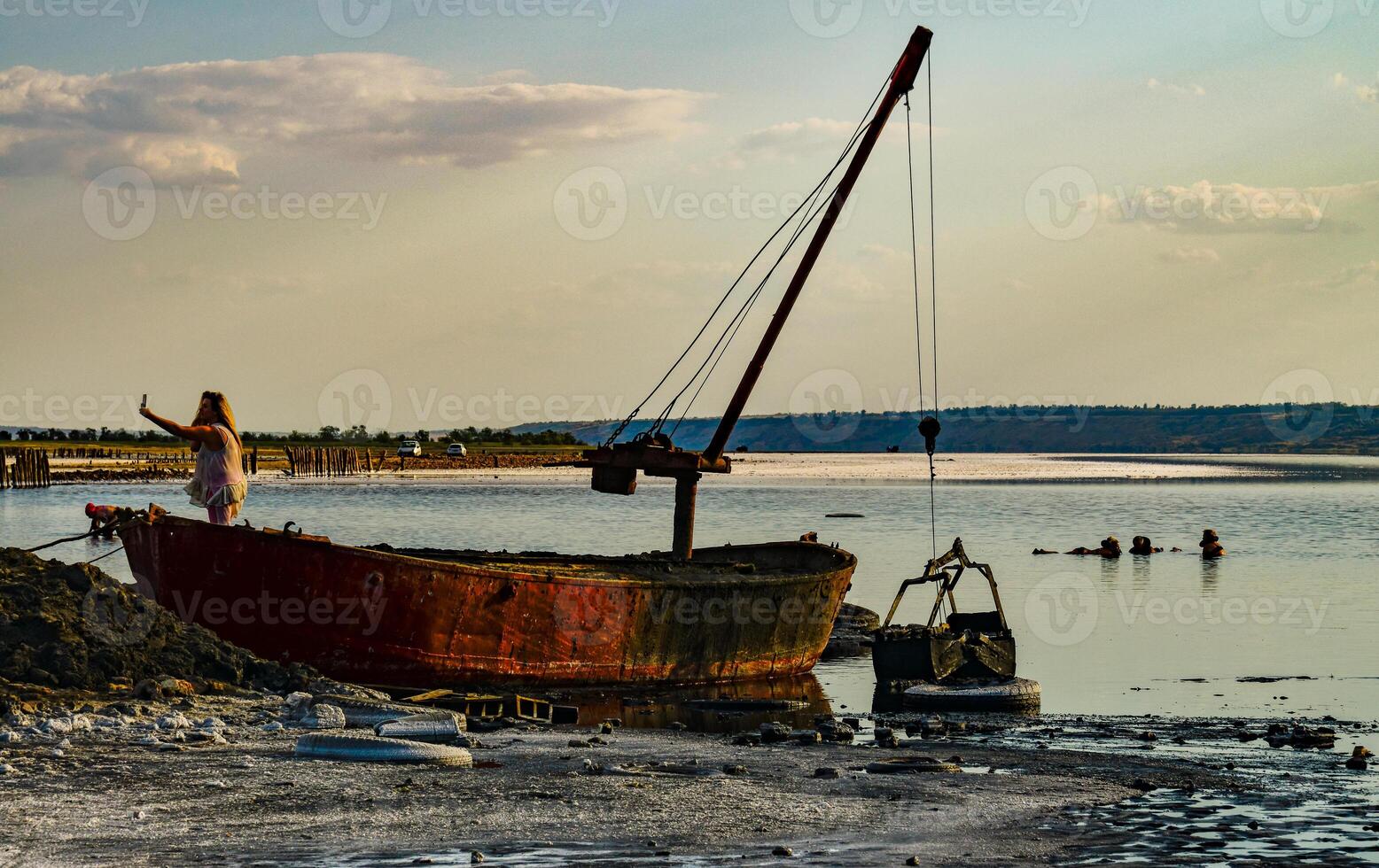 Old iron boat for the extraction of therapeutic mud on the Kuyalnitsky estuary, Ukraine photo