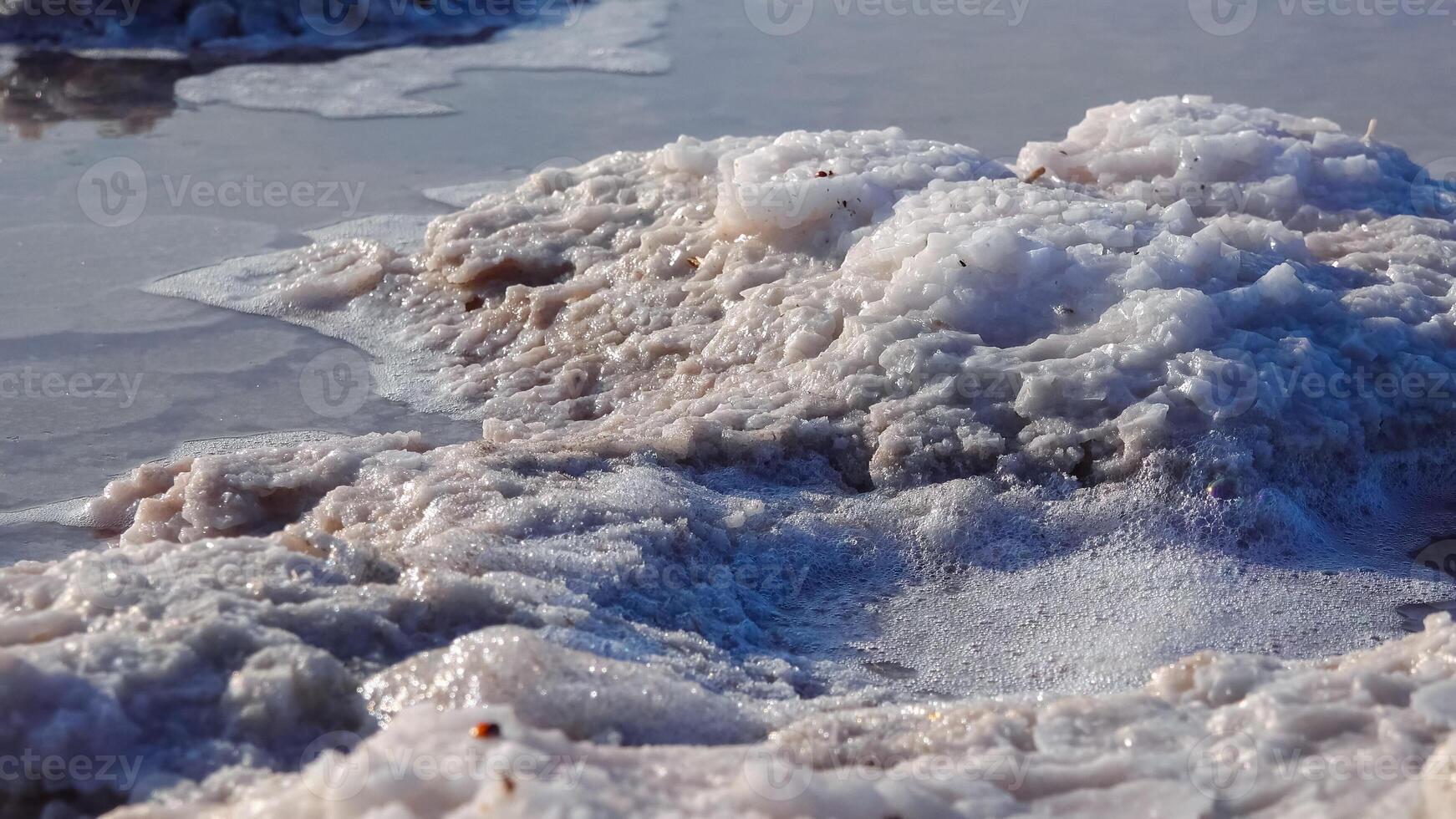 Kuyalnik estuary, Black Sea. Self-precipitating salt at the bottom and bank of the estuary. Table salt crystals photo
