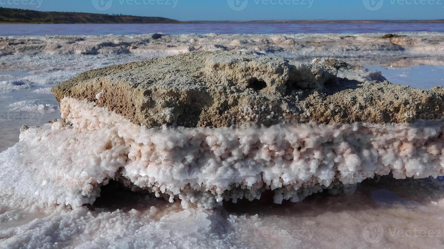 Kuyalnik estuary, Black Sea. Salt crystals cover stones on the shore of a salt lake photo