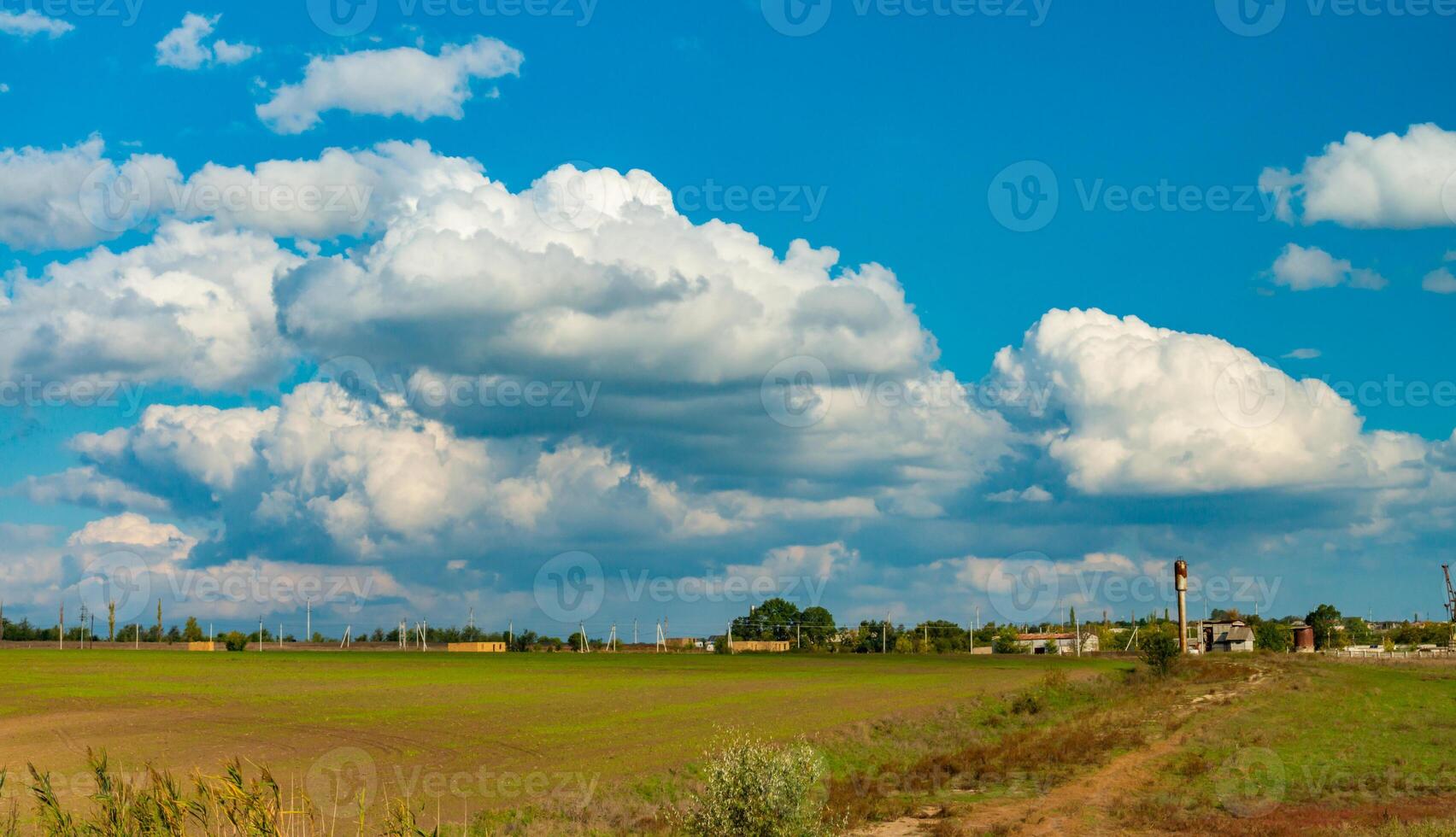 White cumulus storm clouds in the sky during the day, Ukraine photo