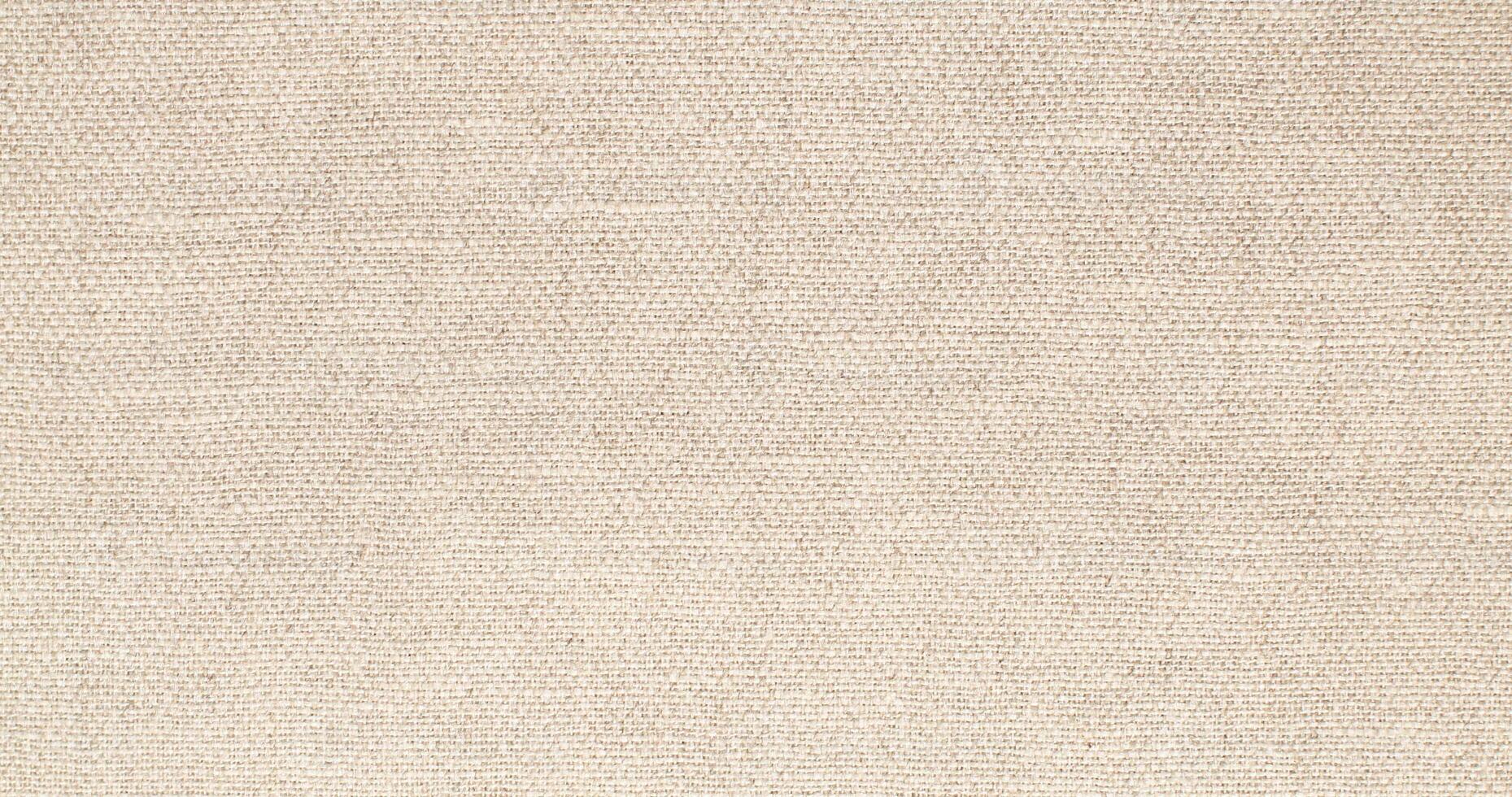 Natural Linen Material Textile Canvas Fabric Texture Background Close-up Detail of Fabric Natural Color Hemp Material Pattern Design Wallpaper. Can be Used as Background or For Graphic Design photo
